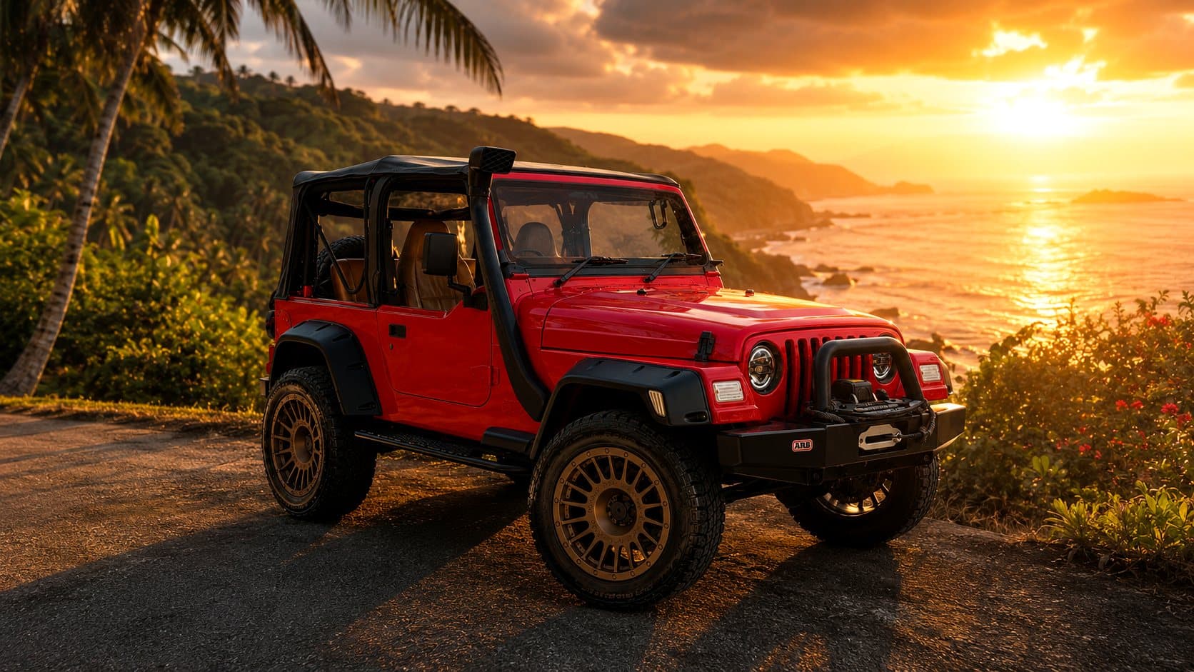 Red Jeep Wrangler at a Koh Samui clifftop viewpoint at sunset