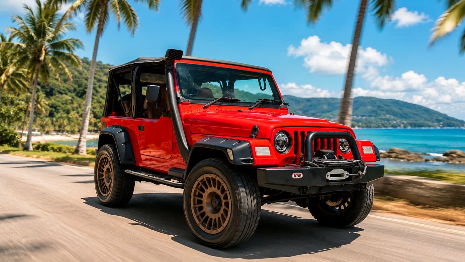 Red Jeep Wrangler cruising a Koh Samui coastal road